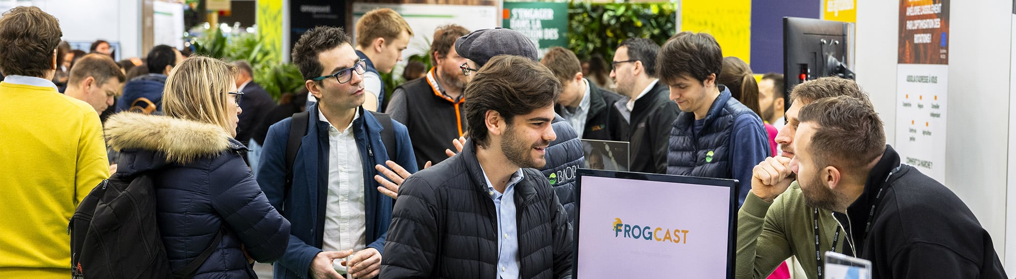 Professionals chatting at a booth